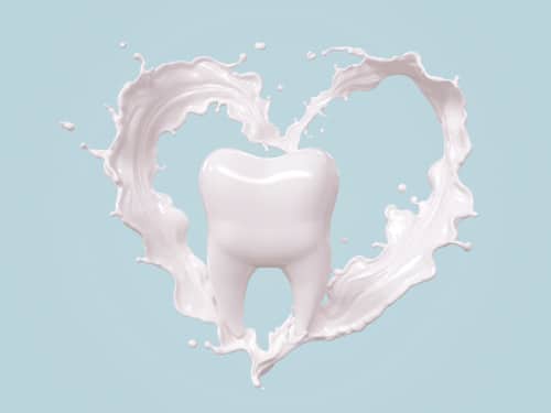 Tooth image surrounded by a milk heart