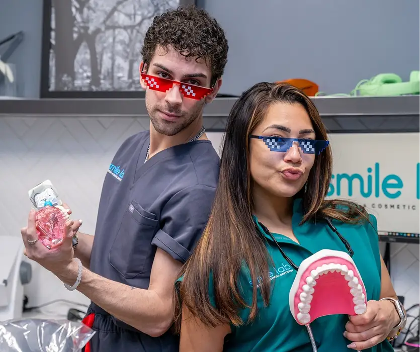 Smile Lab dental team discussing cavity treatment with a patient