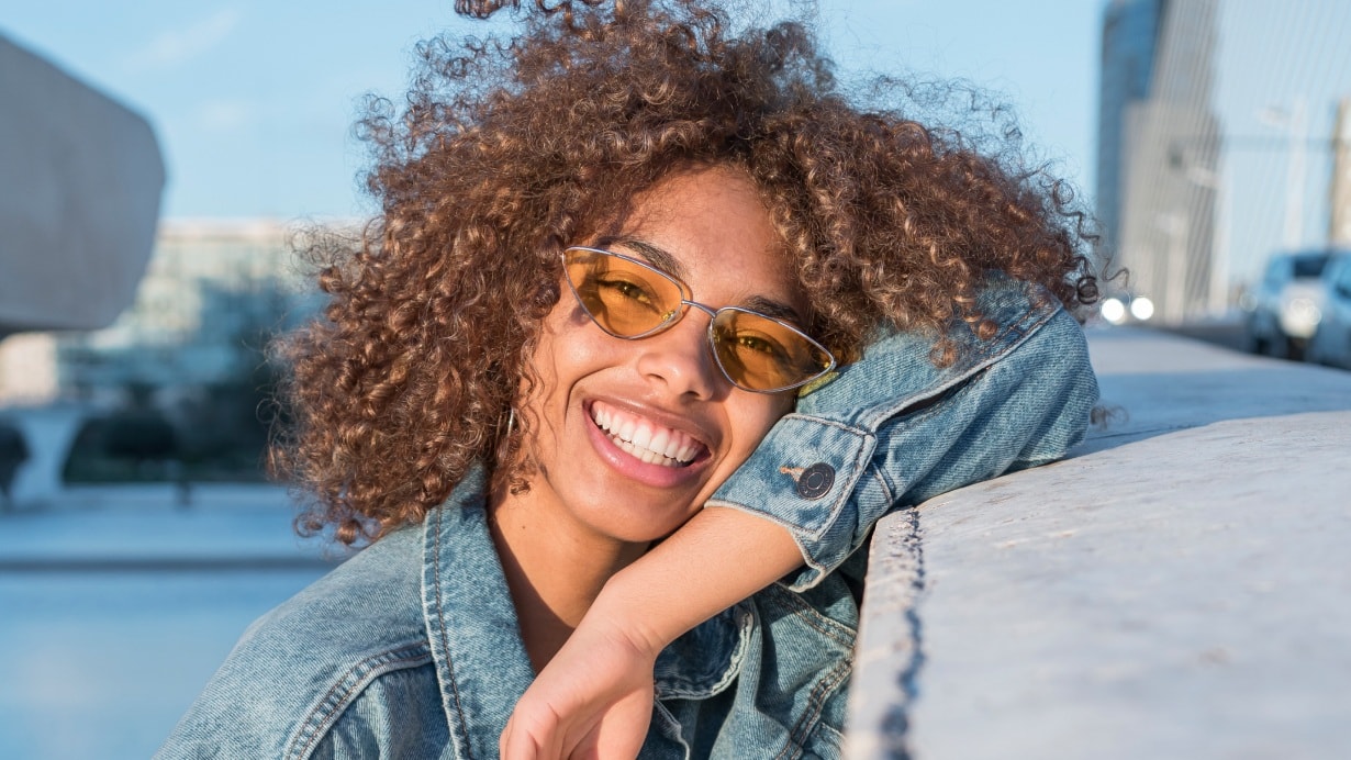 Young woman with glasses smiling