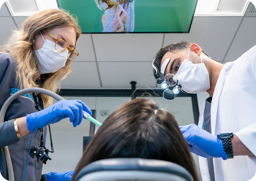 Dentist performing a cavity filling procedure in Manhattan
