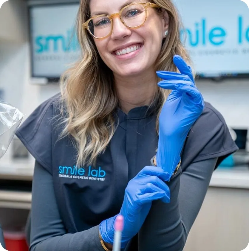 Smile Lab dentist examining a patient during a dental filling appointment
