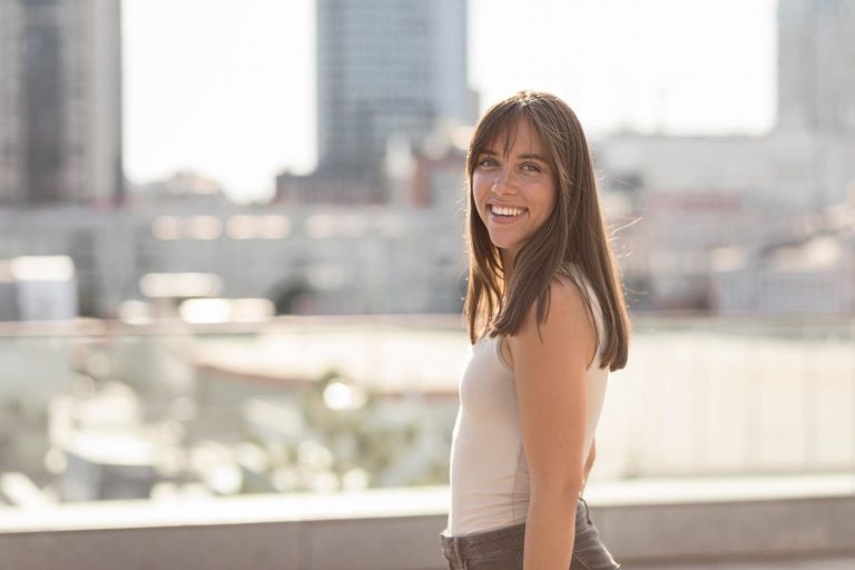 In the heart of New York City, a resilient individual post-tooth extraction. The person displays a sense of strength and determination, navigating the urban landscape with care. Despite the recent dental procedure, their spirit shines through against the iconic backdrop of the city that never sleeps.